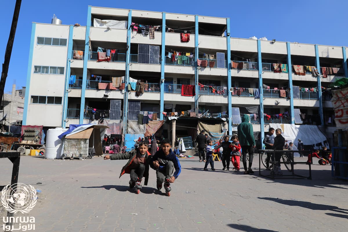 Displaced children play outside an UNRWA school turned shelter in Jabalia camp, Gaza